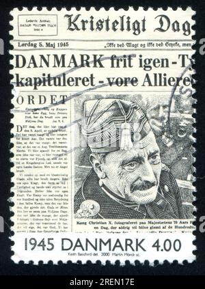 DENMARK - CIRCA 2000: stamp printed by Denmark, shows Liberation of Denmark on front page of newspaper, circa 2000 Stock Photo