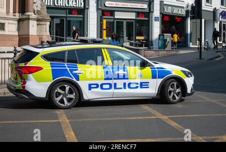 British police from Sussex Police in a panda car in Brighton, Brighton & Hove, East Sussex, England, UK. Stock Photo