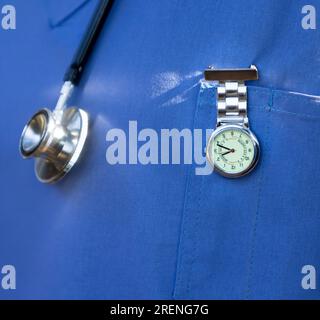 African nurse with a stethoscope and a specialized FOB watch, to keep time at the hospital Stock Photo