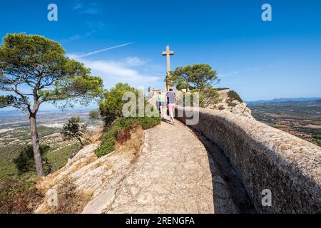 family ascending  to picot cross, Sanctuary of the Mare de Déu de Sant Salvador, XIV century., Felanitx, Majorca, Balearic Islands, Spain Stock Photo