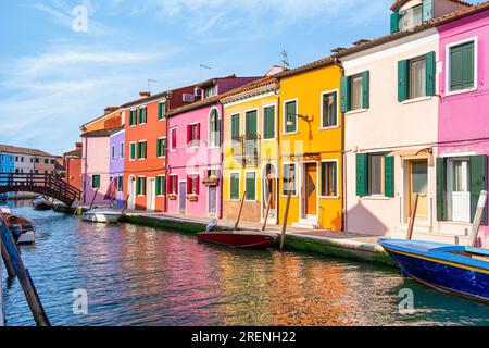 Colorful houses along the water canal in the island of Burano, Venice. Stock Photo