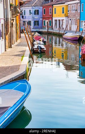 Colorful houses along the water canal in the island of Burano, Venice. Stock Photo