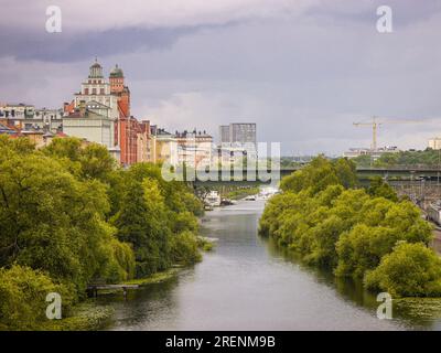 View of river amidst buildings in city Stock Photo