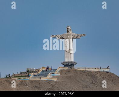 statue of Christ the Redeemer, a 20-meter-high sculpture is made of concrete and painted white, on top of the Colorado hill, Barranca, Peru Stock Photo