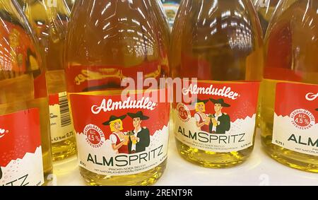 Viersen, Germany - June 9. 2023: Closeup of bottles austrian herbal soft drink Almdudler Almspritz Stock Photo