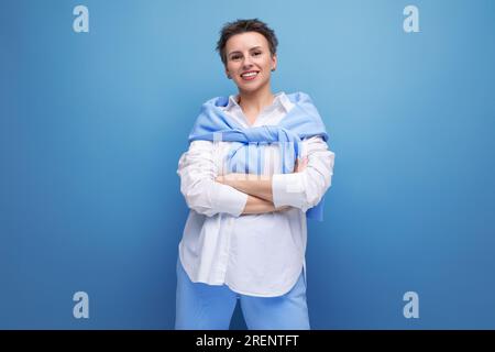 cheerful bright cheerful young dark-haired woman with a short haircut in a white shirt Stock Photo