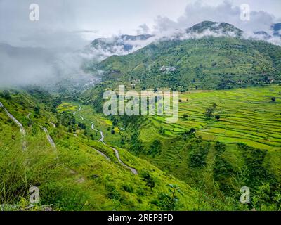 Misty and green mountains in the Himalayas during monsoon season. Uttarakhand India. Stock Photo