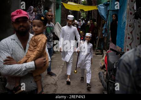 A young Muslim boy displays his stick-fighting skills during a procession  to mark Ashoura in New Delhi, India, Saturday, July, 29, 2023. Ashoura is  the tenth day of Muharram, the first month