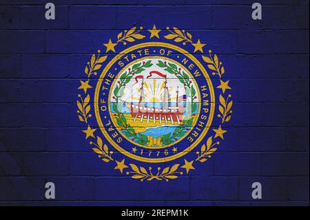 Flag of New Hampshire painted on a cinder block wall. Stock Photo