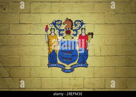 Flag of New Jersey painted on a cinder block wall. Stock Photo