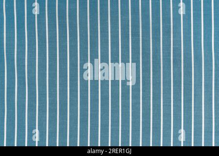 Striped blue white fabric texture background wtih copy space. Shirt fabric, tablecloth textile, garment cloth, upholstery with classic pattern with li Stock Photo