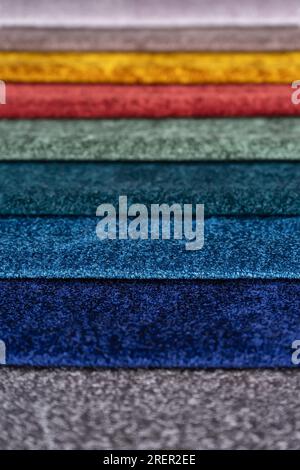 Bright collection of colorful textile samples. Fabric swatches, set in different colors for selection. Variety colors of upholstery material for furni Stock Photo