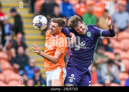 Jake Beesley #18 of Blackpool battles for the high ball during the Pre-season friendly match Blackpool vs Hibernian at Bloomfield Road, Blackpool, United Kingdom, 29th July 2023  (Photo by Craig Thomas/News Images) Stock Photo