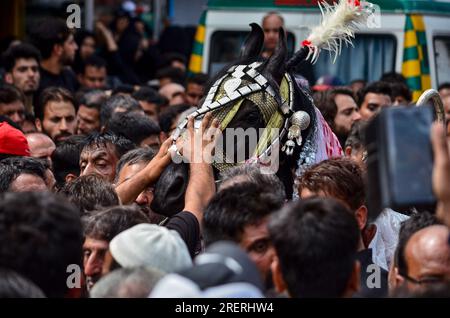 Srinagar, India. 29th July, 2023. Kashmiri Shiite Muslims perform rituals during a religious procession to mark Ashura. Ashura is the tenth day of Muharram, the first month of the Islamic calendar, observed around the world in remembrance of the martyrdom of Imam Hussain, the grandson of Prophet Muhammad (PBUH). (Photo by Saqib Majeed/SOPA Images/Sipa USA) Credit: Sipa USA/Alamy Live News Stock Photo