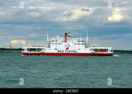 Red Funnel Ferry 'Red Eagle' is seen passing Calshot Castle on one of it's many daily round trips from Cowes Isle of Wight to Southampton Hampshire. Stock Photo