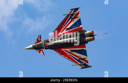 Old Buckenham Aerodrome, Norfolk, UK. 29th Jul 2023. An RAF Eurofighter Typhoon FGR.4 piloted by Flight Lieutenant Matt Brighty from 29 Squadron based at RAF Coningsby in Lincolnshire puts on a dazzling display with his Union Jack emblazoned aircraft at the Old Buckenham Airshow. Credit: Stuart Robertson/Alamy Live News. Stock Photo