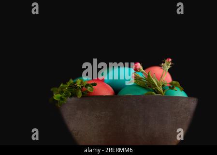 Red and blue decorated Easter eggs painted by hand on a dark background, Easter, stylish minimal composition Stock Photo