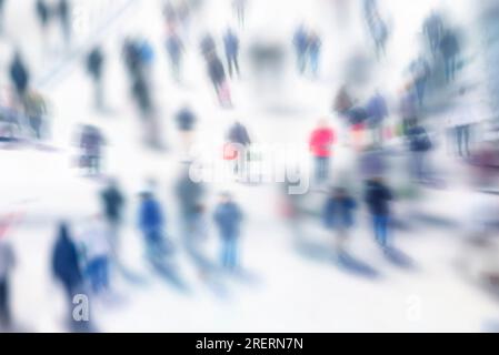 Blurred image of people walking in the city. Abstract background. Blur abstract people in motion background, unrecognizable silhouettes of people walk Stock Photo