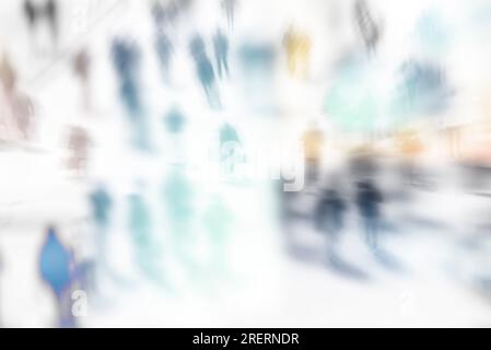 Blurred image of unrecognizable silhouettes of people walking in the city. Abstract background. Blur abstract people in motion background Stock Photo