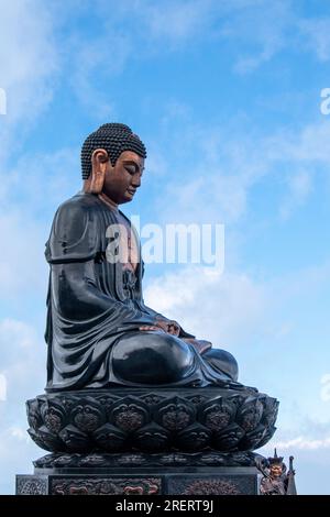 Large Buddha statue sitting atop Mount Fansipan near Sapa in northern Vietnam Stock Photo