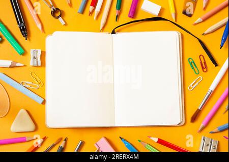 School supplies on yellow background Stock Photo