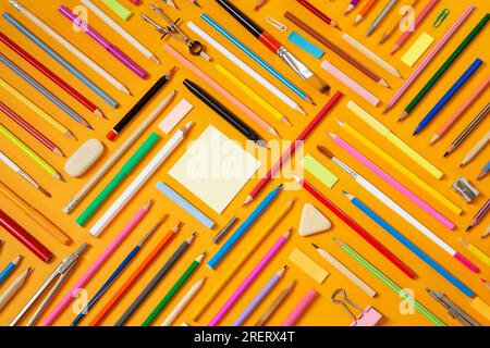 School supplies on yellow background Stock Photo