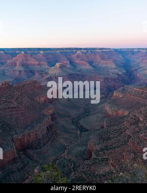 Evening descends over the winding trails of the Grand Canyon. Stock Photo