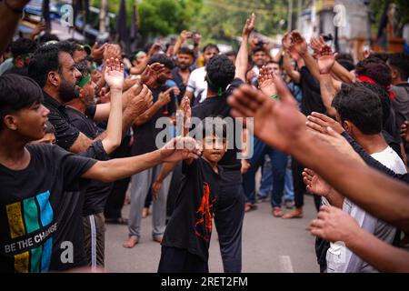 A young Muslim boy displays his stick-fighting skills during a procession  to mark Ashoura in New Delhi, India, Saturday, July, 29, 2023. Ashoura is  the tenth day of Muharram, the first month