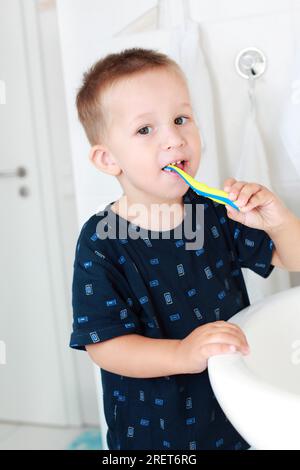 Dental care - small boy washing his teeth Stock Photo