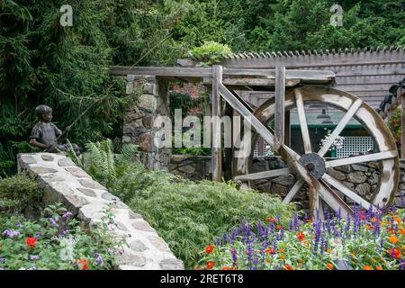 The Bronze Statue Of A Young Boy Fishing In The Gardens Of The