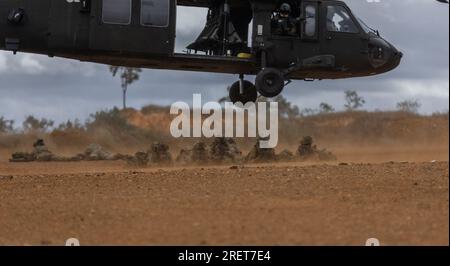 Soldiers from Battle Group Ram conduct air mobility operations supported by Battle Group Griffin during exercise Talisman Sabre 23 in Townsville Field Training Area, Queensland, Australia, July 26, 2023. Battle Group Ram consists of soldiers from Australia, United States, New Zealand, Fiji and France.     Talisman Sabre is a large-scale, bilateral military exercise between Australia and the United States which strengthens relationships and interoperability among key allies and enhances our collective capabilities to respond to a wide array of potential security concerns. This exercise will be Stock Photo