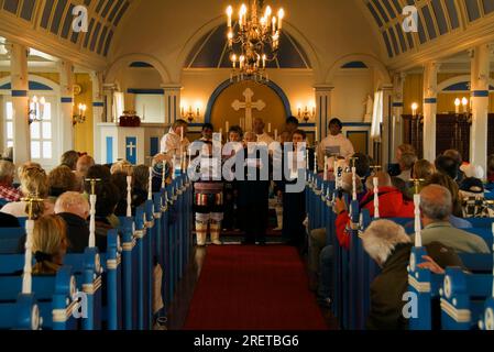 People at worship in church, Narsaq, Greenland Stock Photo