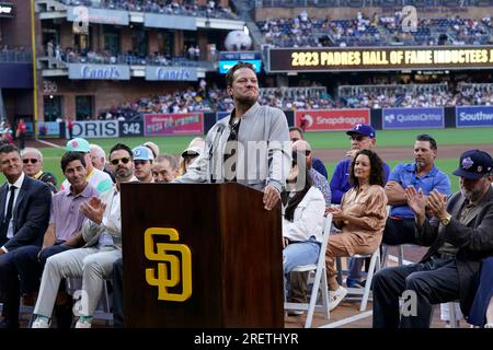 Former San Diego Padres pitcher Jake Peavy speaks during his induction into  the Padres Hall of Fame, before a baseball game against the Texas Rangers  Friday, July 28, 2023, in San Diego. (