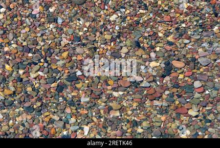 Pebbles seen through sparkling clear water in lake in Grand Tetons National Park, Wyoming, USA Stock Photo