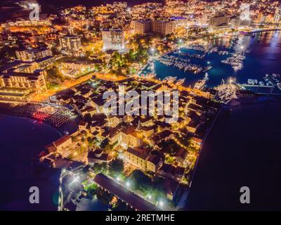 Budva city lights from Montenegro seen from above. Night view. Drone old town Budva at night Stock Photo