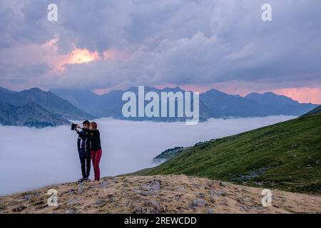 couple taking a selfie, Cirque de Gavarnie from Espuguettes refuge, Pyrenees National Park, Hautes-Pyrenees, France Stock Photo