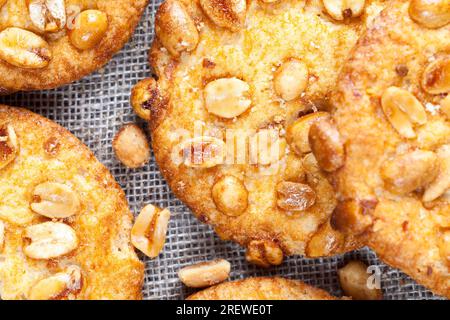 crunchy cookies with roasted peanuts, on the surface of a round fresh cookie caramel with peanuts, delicious round cookies from different ingredients Stock Photo