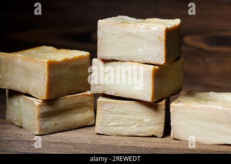 Bars of traditional aleppo natural laurel soap on a wooden background. Natural cosmetics, scik care and dermatology concept Stock Photo