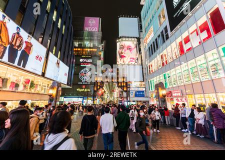 Night time view from the Ebisu bridge at Dotonbori, Osaka, of the entrance to the very long covered and crowded shopping street, Shin Sai bashi suji. Stock Photo