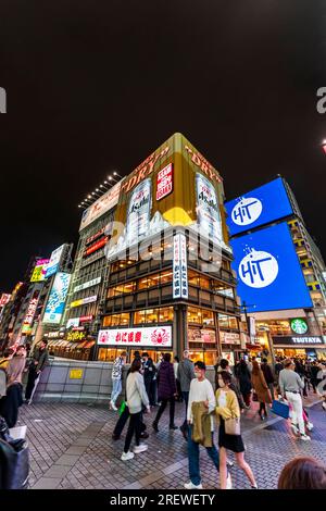 Night view of the Kani Doraku restaurant building with it's giant neon sign of a Asahi beer can. seen from the Ebisu Bridge at Dotonbori, Osaka. Stock Photo