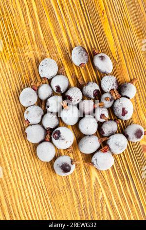 frozen black currant close up, natural food grown on a farm, black currant berries frozen and covered with a layer of rime Stock Photo