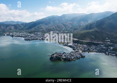 Village and lake. Photo in Shuanglang, Yunnan, China. Stock Photo