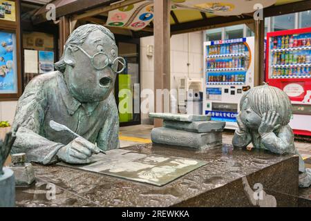 June 2023, Sakaiminato. Mizuki Shigeru portrayed with his yokai characters from his manga GeGeGe no Kitaro in front of Sakaiminato train station. Stock Photo