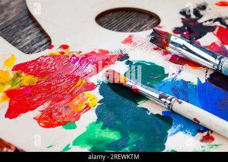 oil and other paints with brushes for creativity, the creative process of  drawing by mixing different colors of paints with art brushes, art brushes  a Stock Photo - Alamy