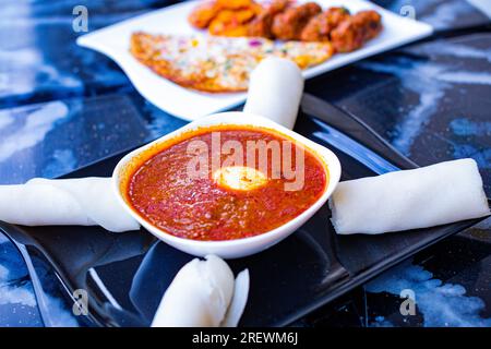 Nyama Choma Sukuma wiki Pilau Ugali Chapati Githeri Mandazi Mukimo Matoke Mutura Ugali popular foods in kenya IRIO Wali wa nazi (coconut rice) Chips m Stock Photo