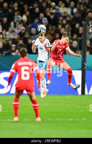 Dunedin, New Zealand. 30th July, 2023. Seraina Piubel (R) of Switzerland vies with Rebekah Stott (C) of New Zealand during the group A match between Switzerland and New Zealand at the 2023 FIFA Women's World Cup in Dunedin, New Zealand, July 30, 2023. Credit: Zhu Wei/Xinhua/Alamy Live News Stock Photo