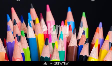 ordinary colored wooden pencil with soft lead of different colors for drawing and creativity, closeup of pencils after sharpening and use, pencil made Stock Photo