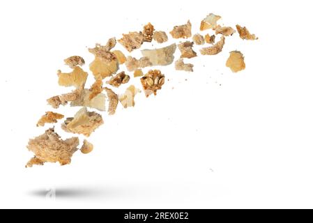 Flying crumbs. Crumbs of different bread on a white isolated background ...