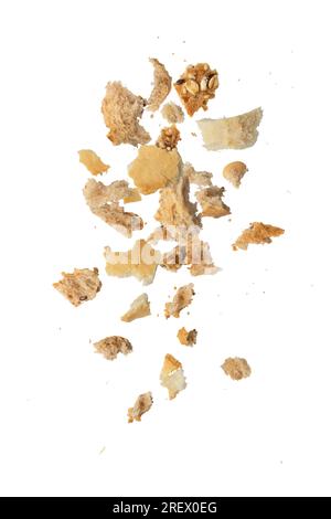 Flying crumbs. Crumbs of different bread on a white isolated background ...