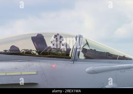 Fighter pilot. Royal Air Force, RAF, Eurofighter Typhoon F2 fighter jet pilot in cockpit holding face mask. For Southend Airshow Stock Photo